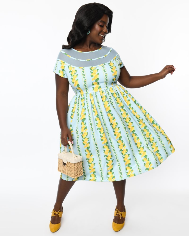 Front of a model wearing a size 5X/26 Unique Vintage Plus Size Mint & Lemon Print Flare Dress in Mint & Lemon Print by Unique Vintage. | dia_product_style_image_id:269800